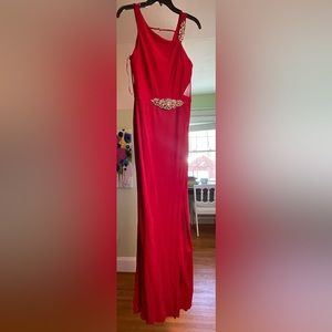 Mignon Red Gown with embellishments on shoulder and mid section. Size 4.